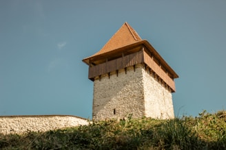 a stone building with a pointed roof