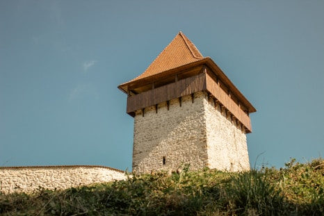 a stone building with a pointed roof