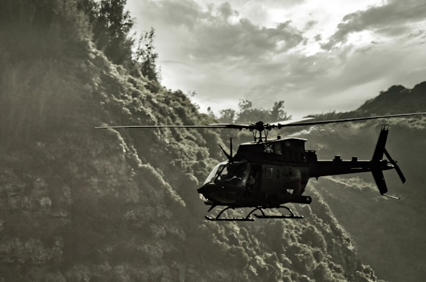 Montana Air Filming aircraft flying over mountainous landscape during golden hour.