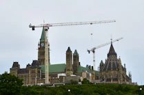 a crane next to a building