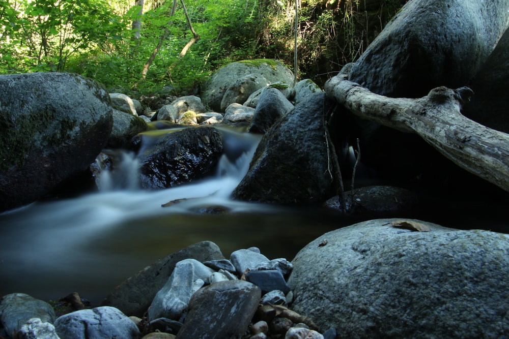 a stream of water flowing through rocks