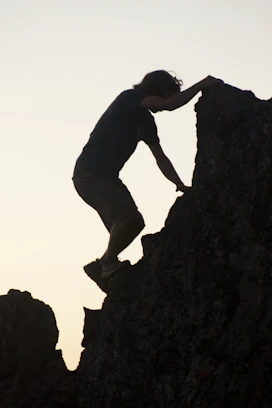 a man climbing a rock