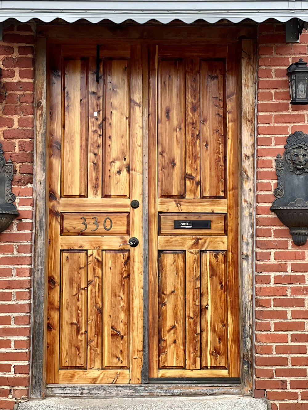 a wooden door on a brick building