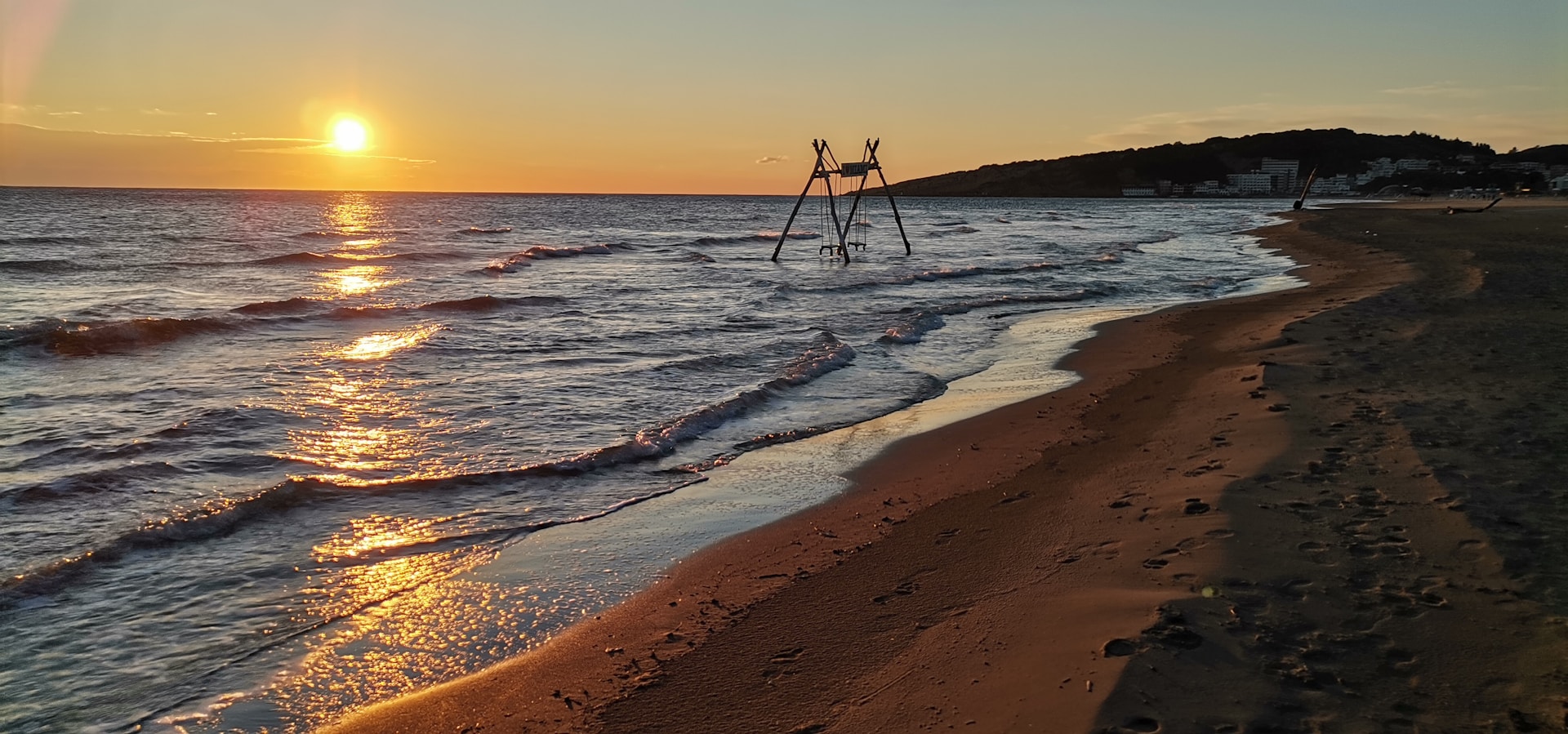 a beach with a sunset