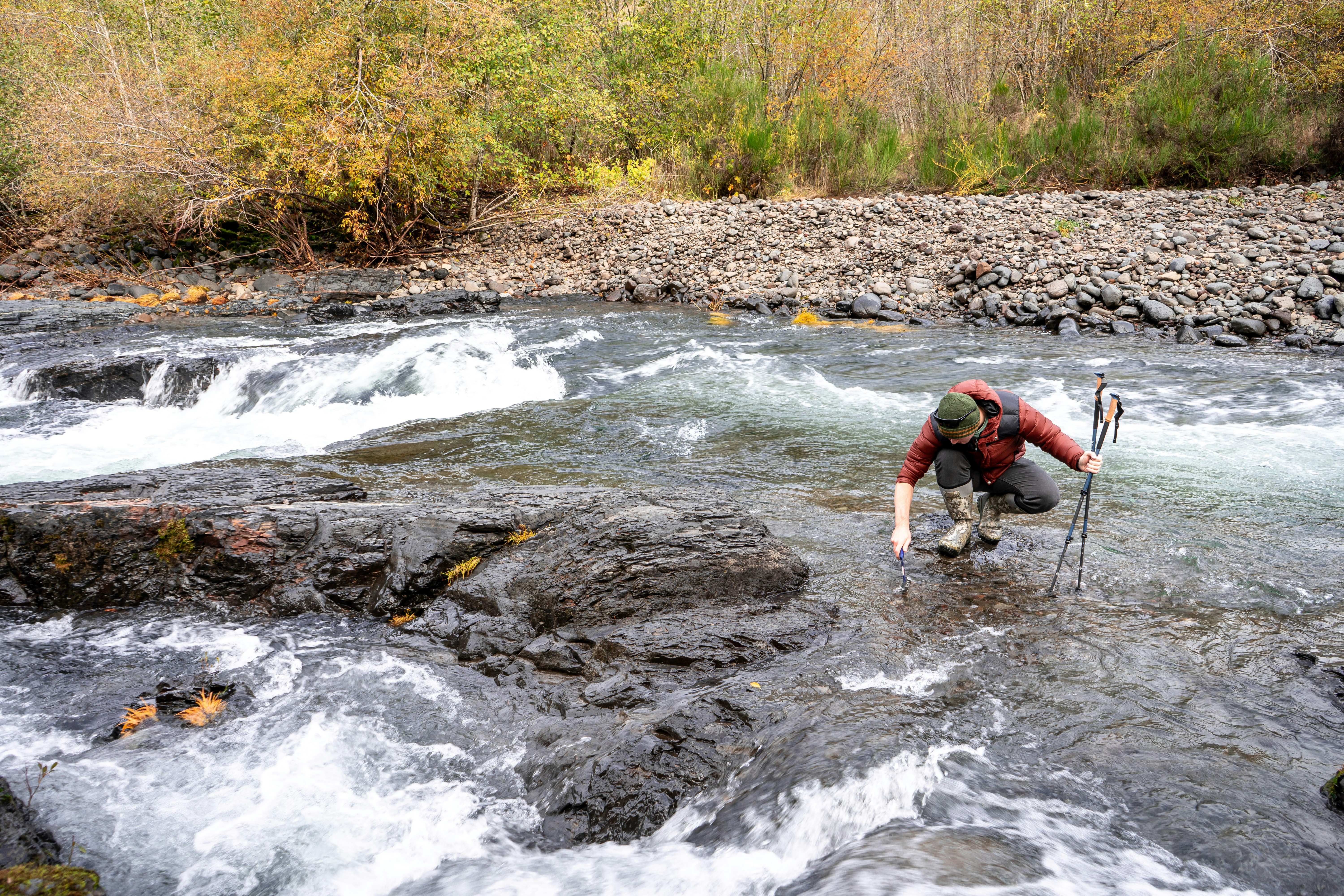a man fishing in a river