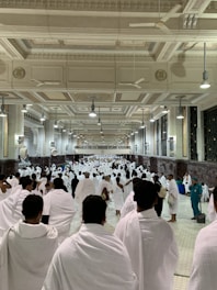 a group of people in white robes