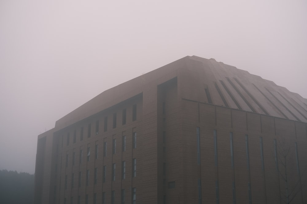 a building with a foggy sky