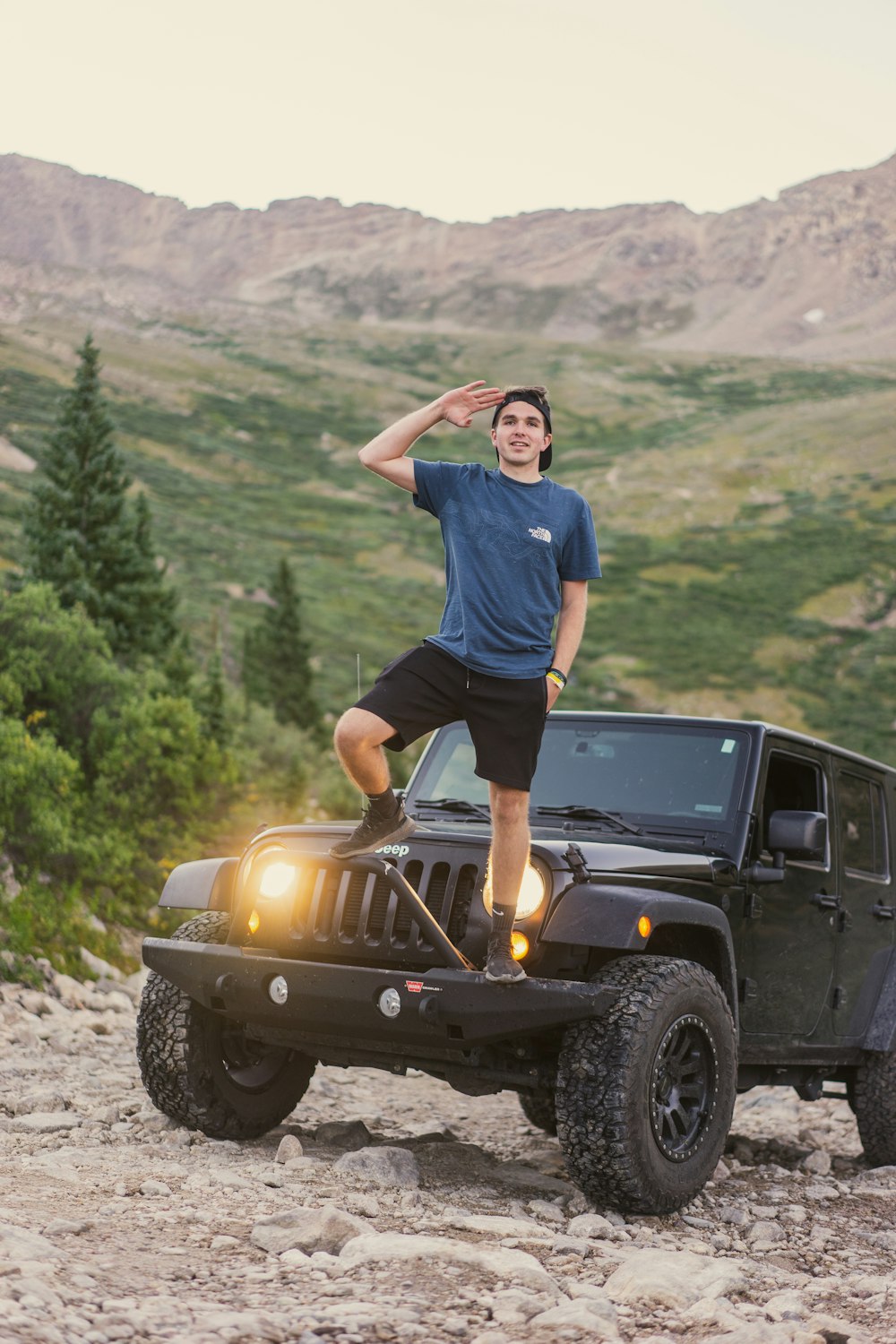 a man standing on a jeep