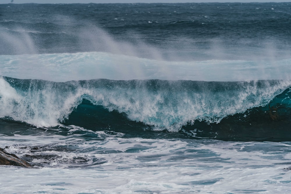 a wave crashing on a beach