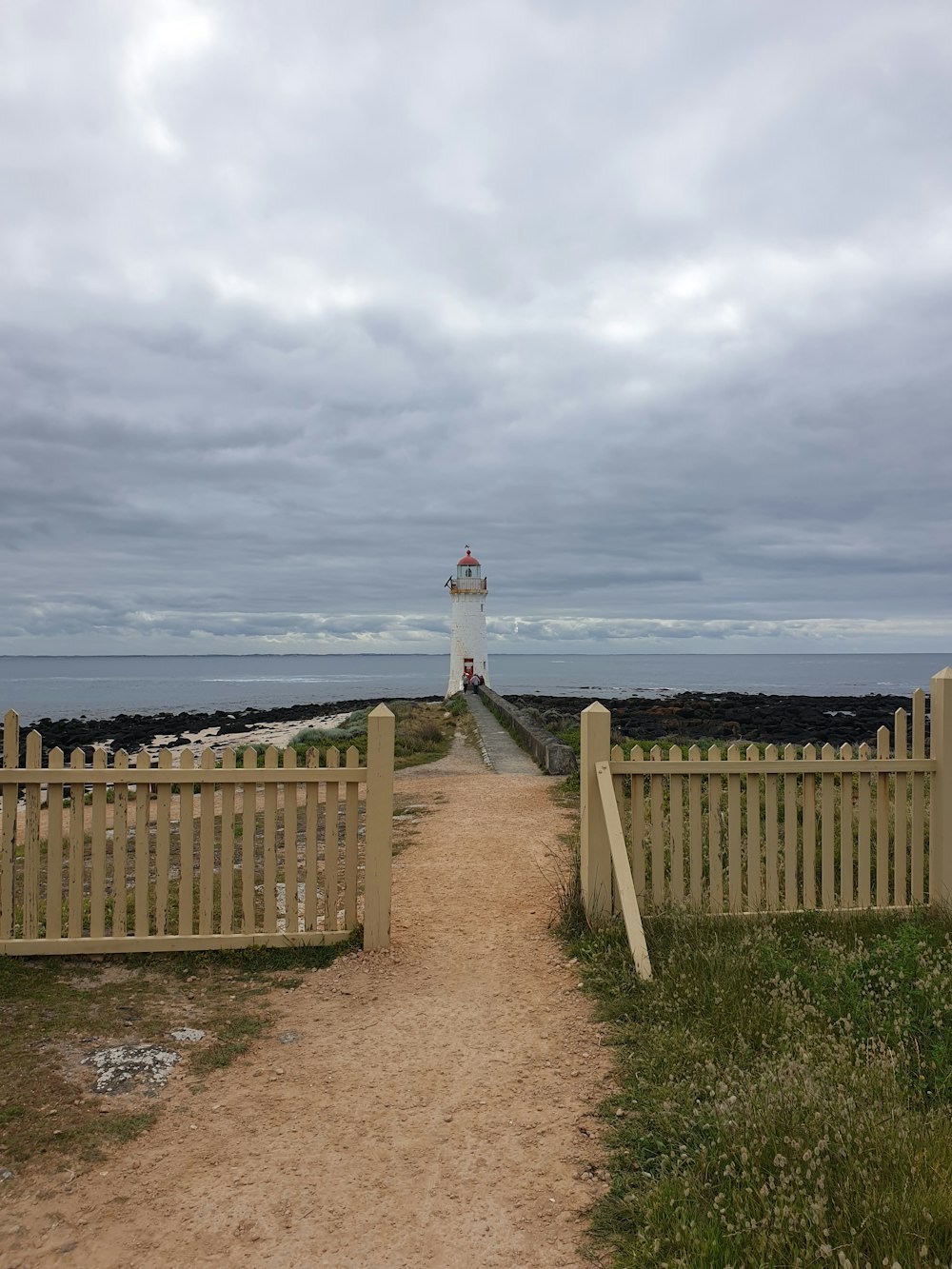 a path leading to a lighthouse