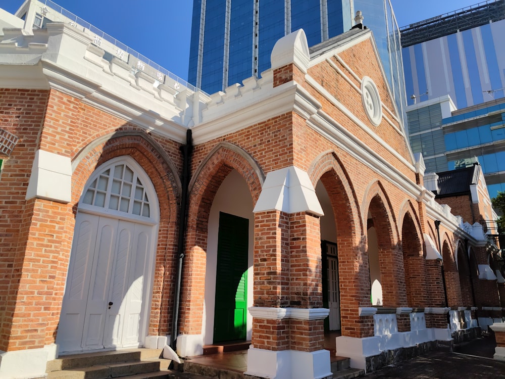 a brick building with a few arched doorways