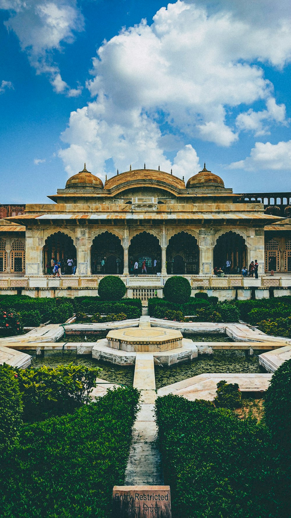 a large building with a fountain in front of it