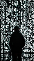 a person standing in front of a wall of lights