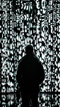 a person standing in front of a wall of lights