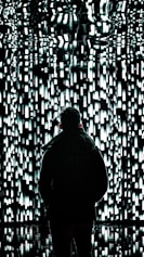 a person standing in front of a wall of lights
