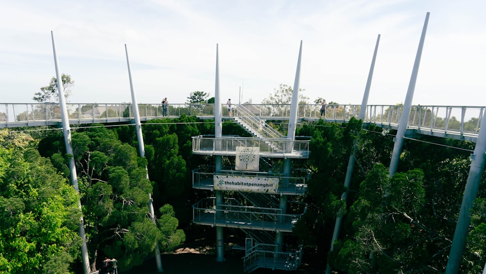 a roller coaster going over a bridge