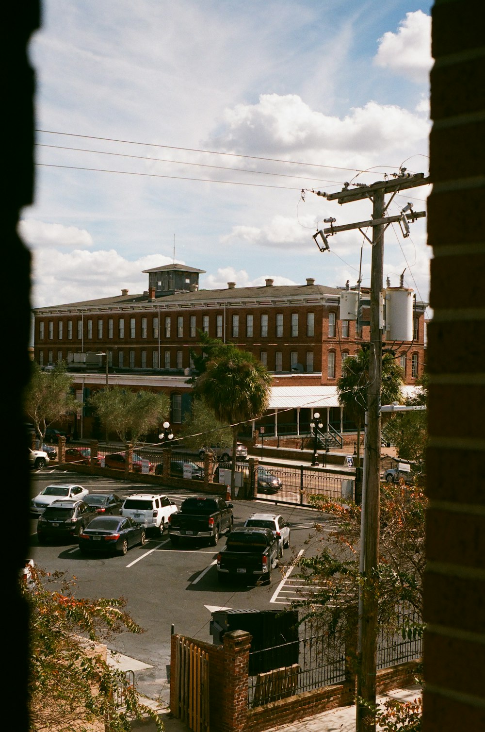 a street with cars and buildings on the side