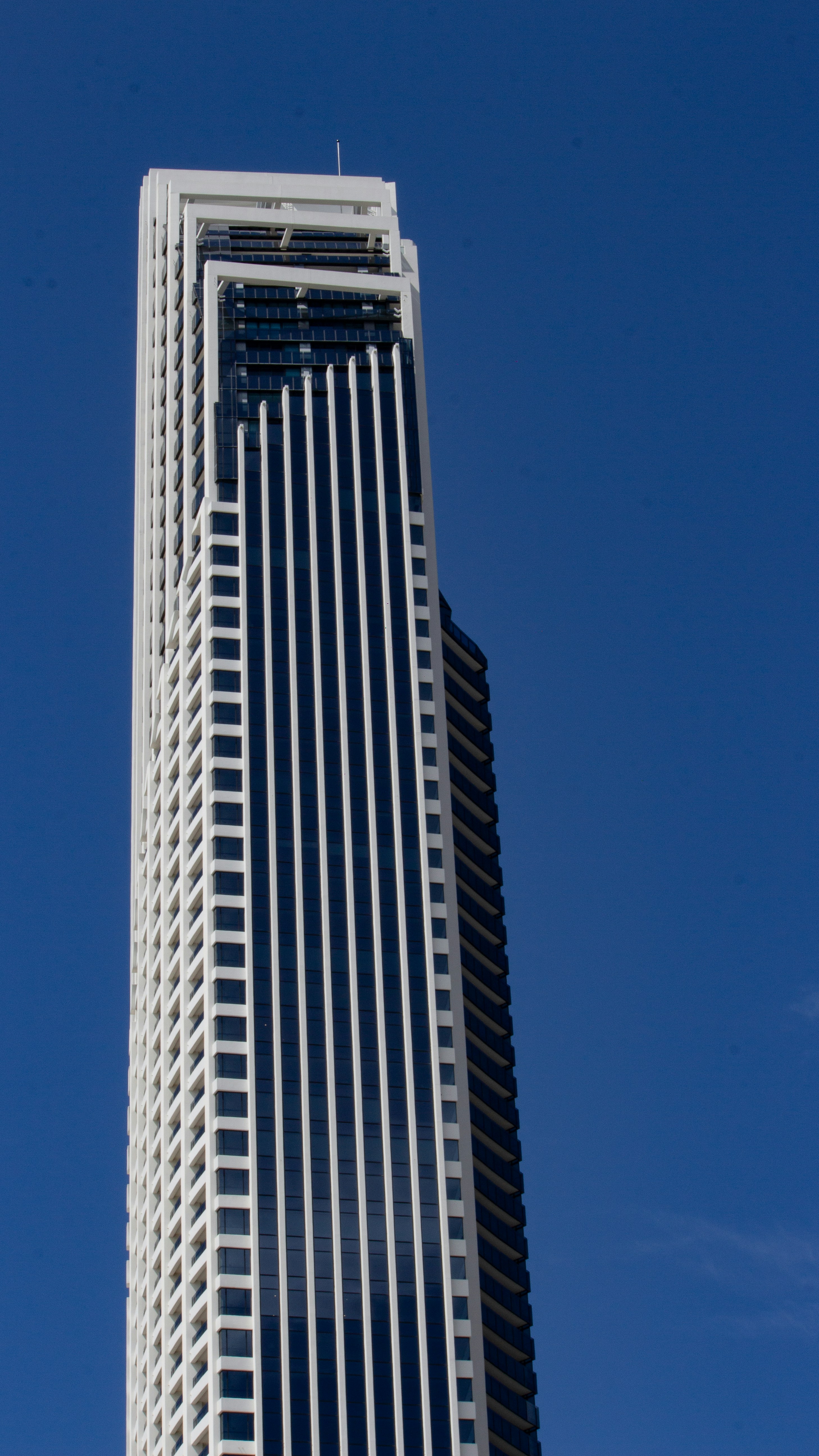 a tall building with a blue sky