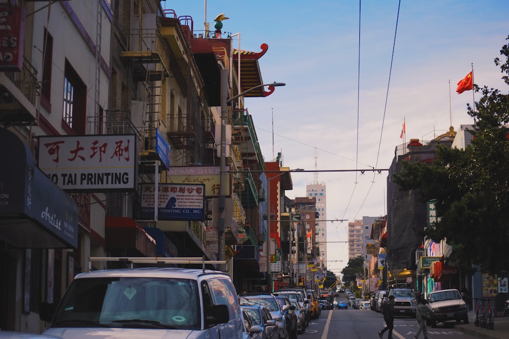 a busy street with cars and people