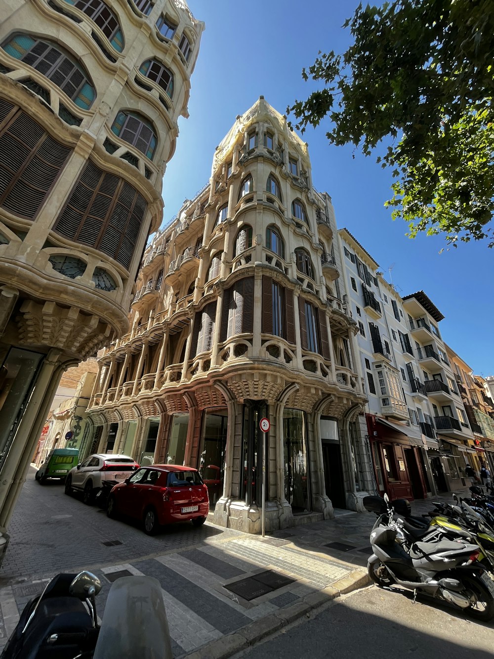 a street with cars and buildings on either side of it