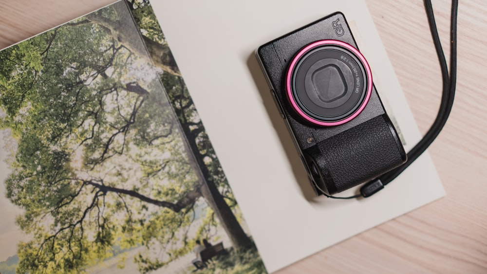 a black and red headphones on a wooden surface