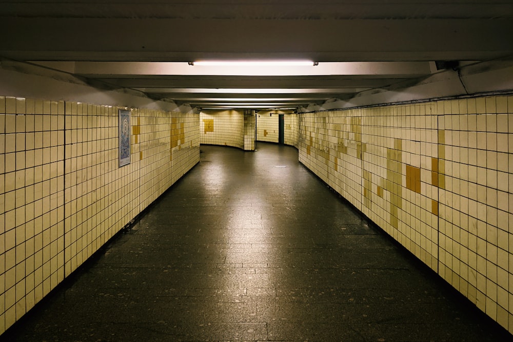 a hallway with yellow and black tiles