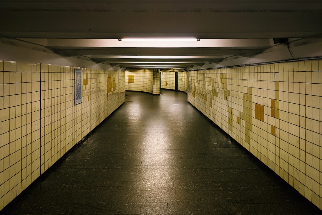 a hallway with yellow and black tiles,