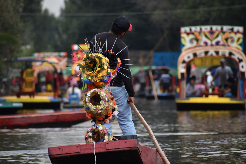 a person in a boat carrying flowers
