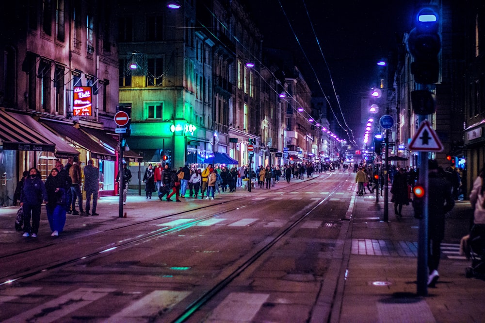 a busy city street at night