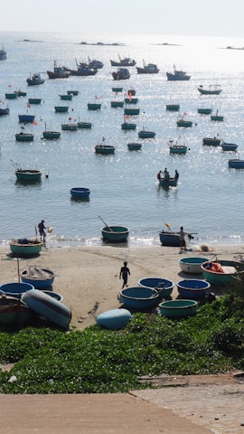 A serene coastal scene in Malindi with fishermen preparing their boats at dawn.