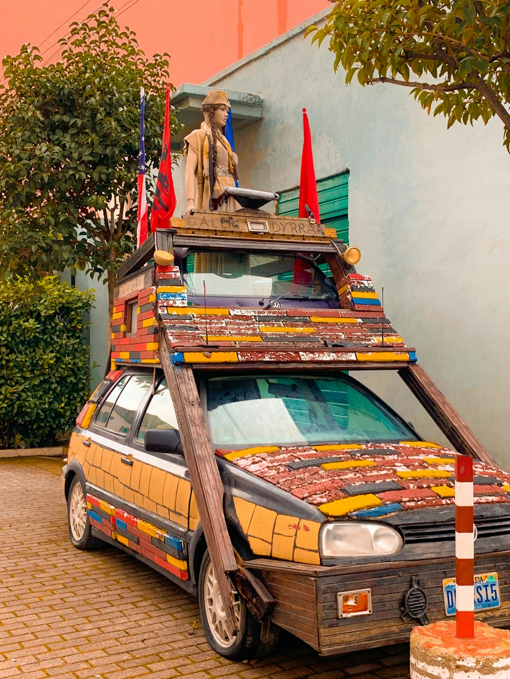 a car with a statue on top