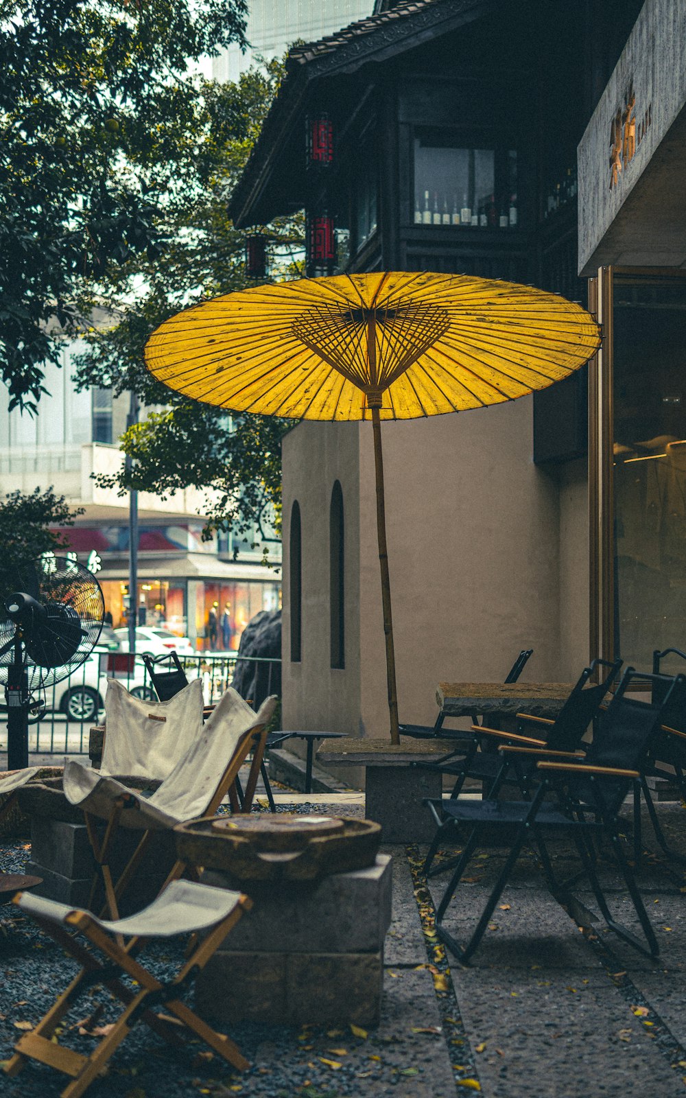 a yellow umbrella is from a building