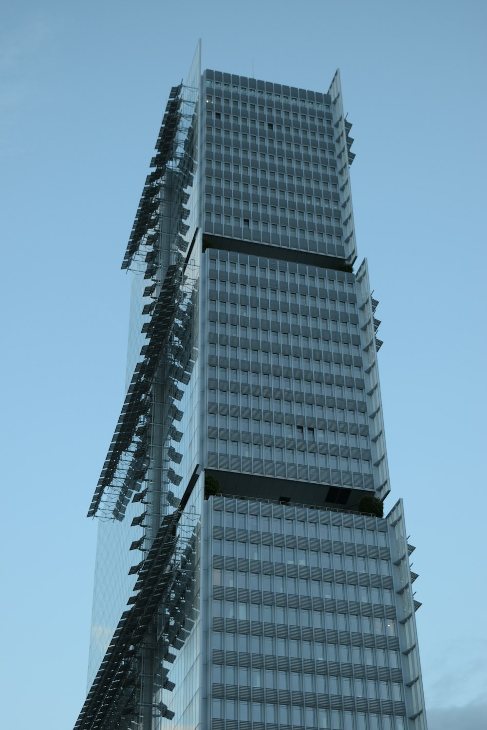 a tall building with a glass front