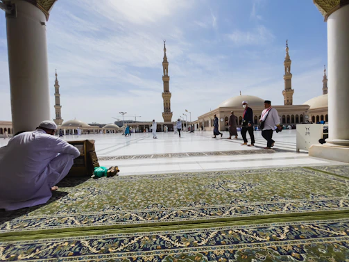 A peaceful mosque courtyard with empty benches inviting silent prayer and remembrance.