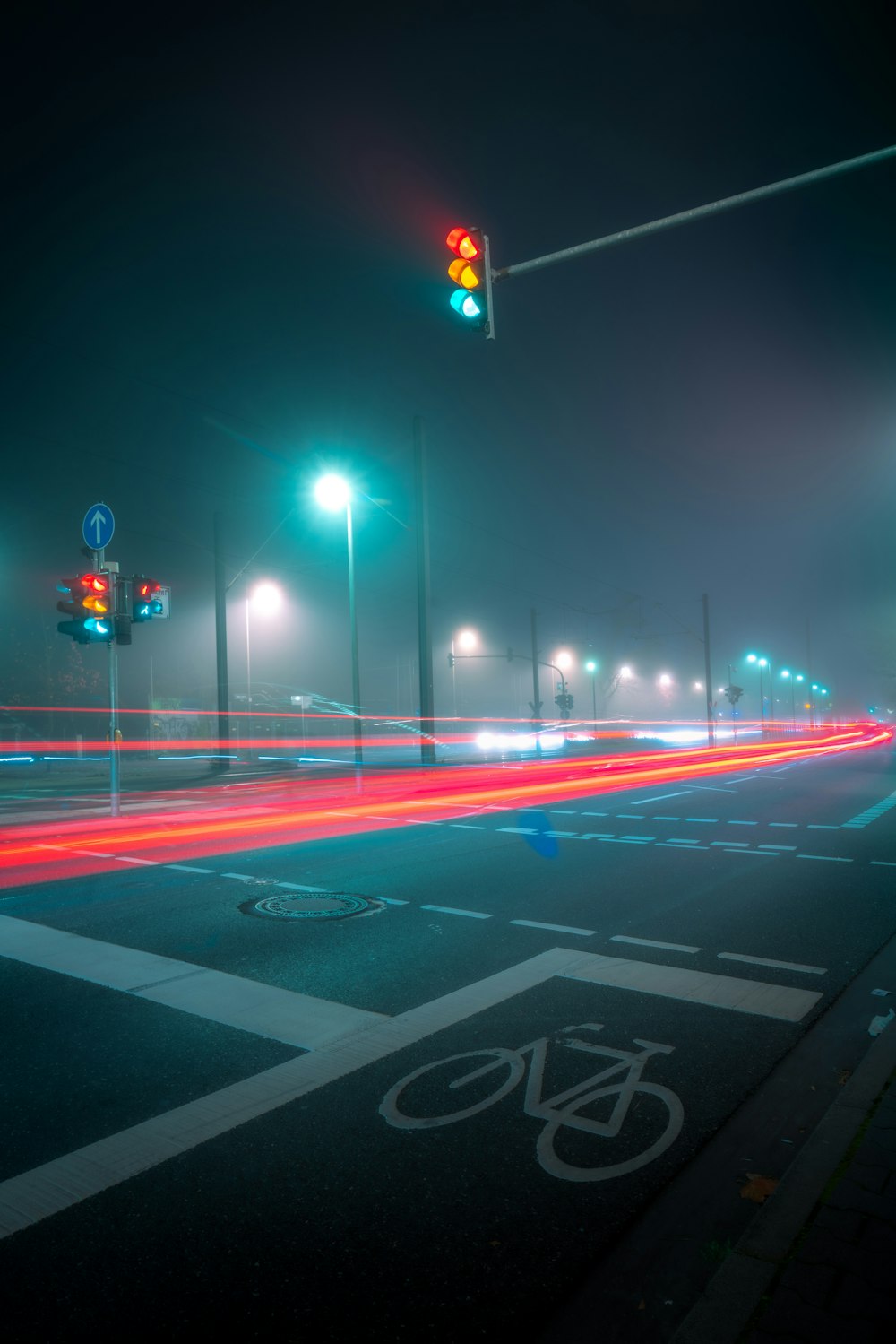 a bicycle lane is lit up at night