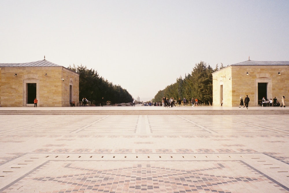 a courtyard with people walking around