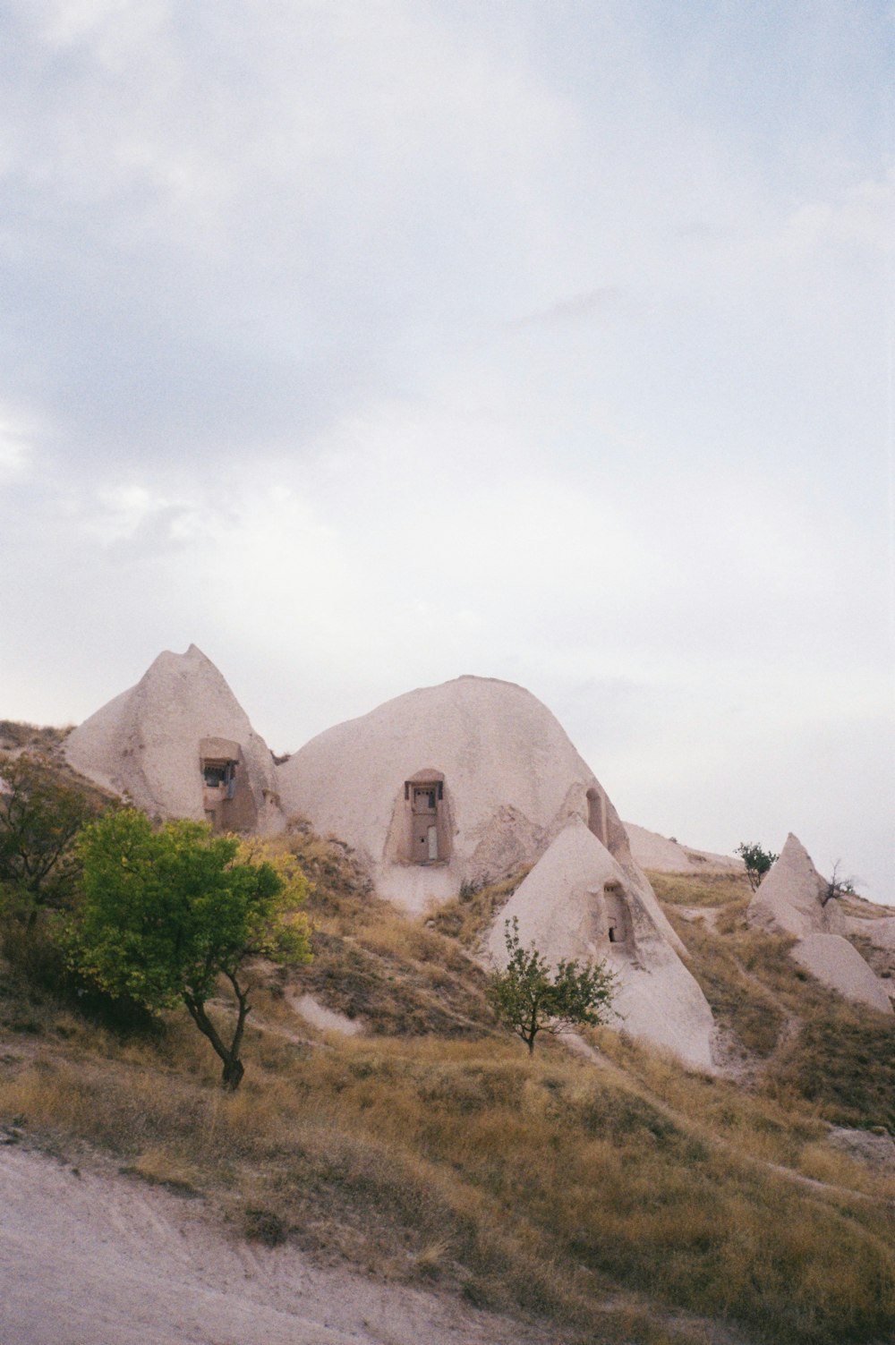 a stone building on a hill