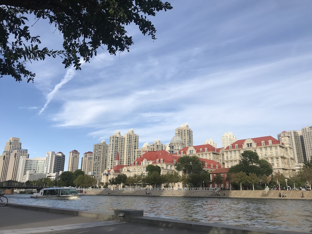 a body of water with buildings in the background