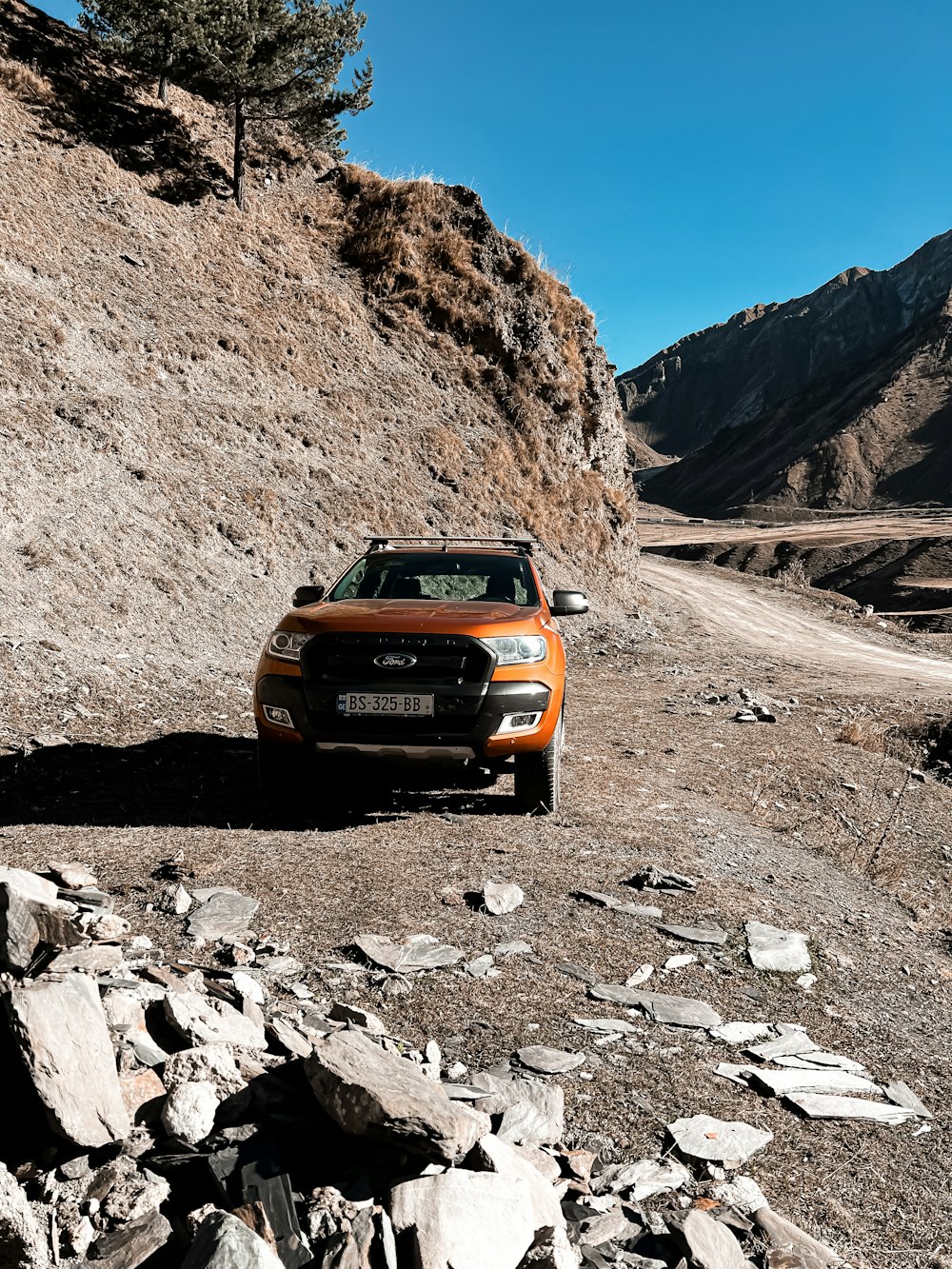 a car driving on a dirt road