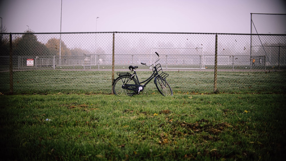 a bicycle parked on a field