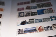 A neatly organized album page filled with colorful stamps from various decades.