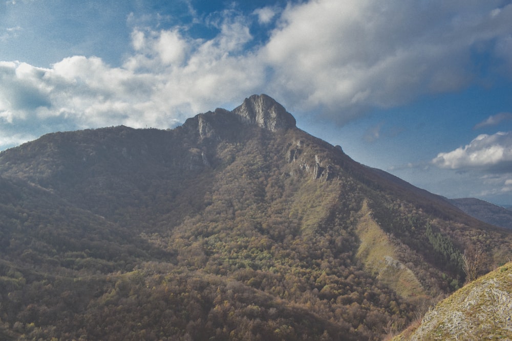 a mountain with a valley below