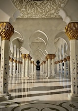 a large ornate room with a large chandelier and a large staircase