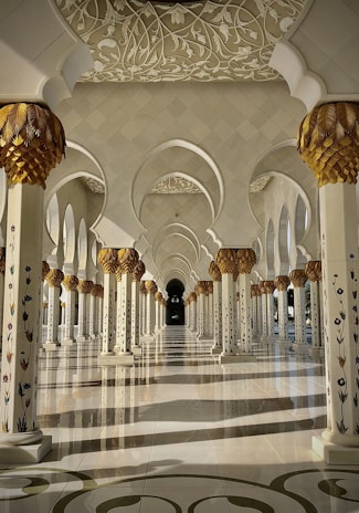 a large ornate room with a large chandelier and a large staircase