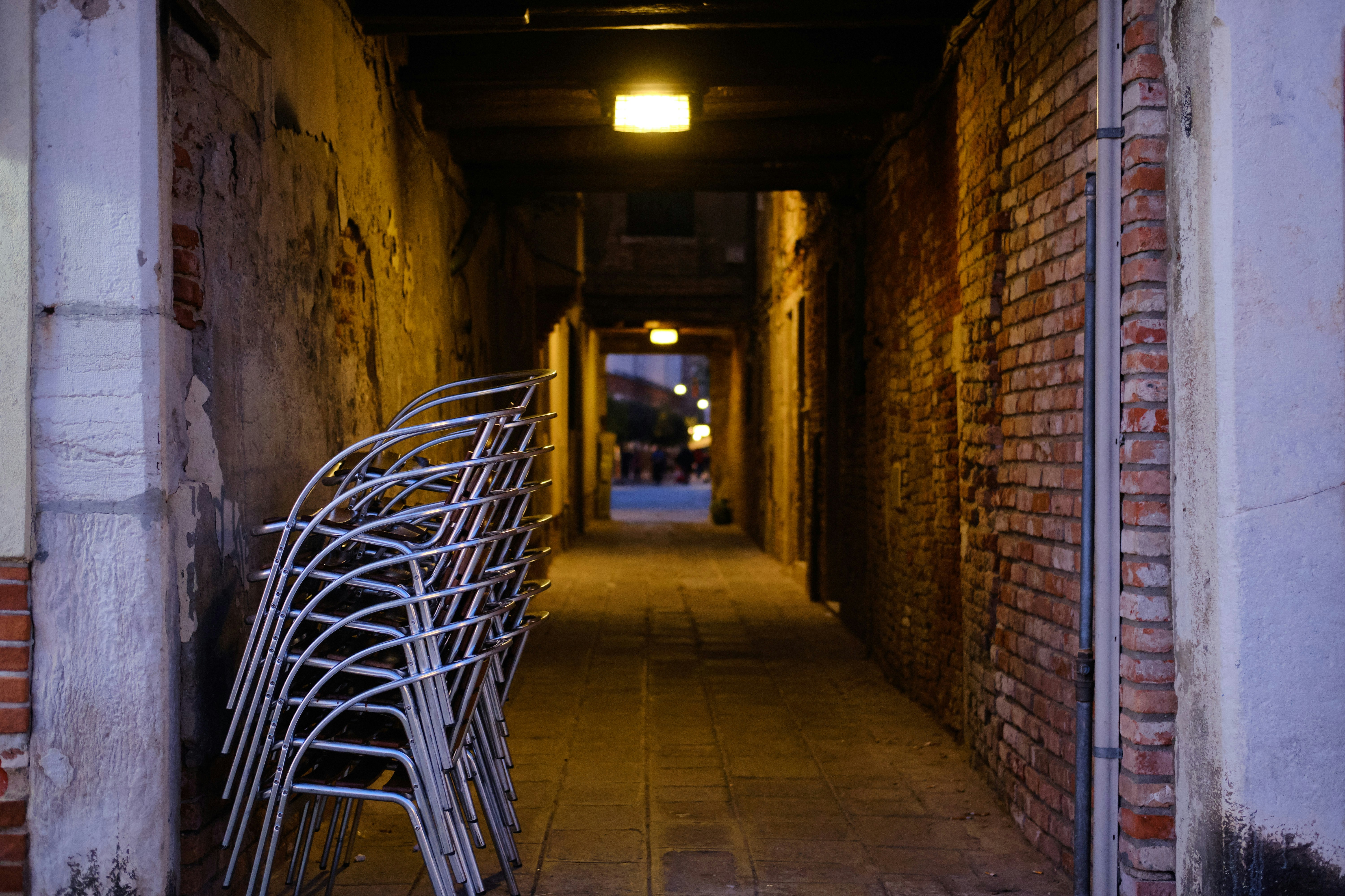 a brick walkway with a shopping cart