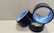 Three rolls of black adhesive tape with blue inner linings are placed on a textured cardboard surface. The rolls are partially unwound, and each displays the brand name 'Stefil' on the inside.