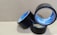 Three rolls of black adhesive tape with blue inner linings are placed on a textured cardboard surface. The rolls are partially unwound, and each displays the brand name 'Stefil' on the inside.