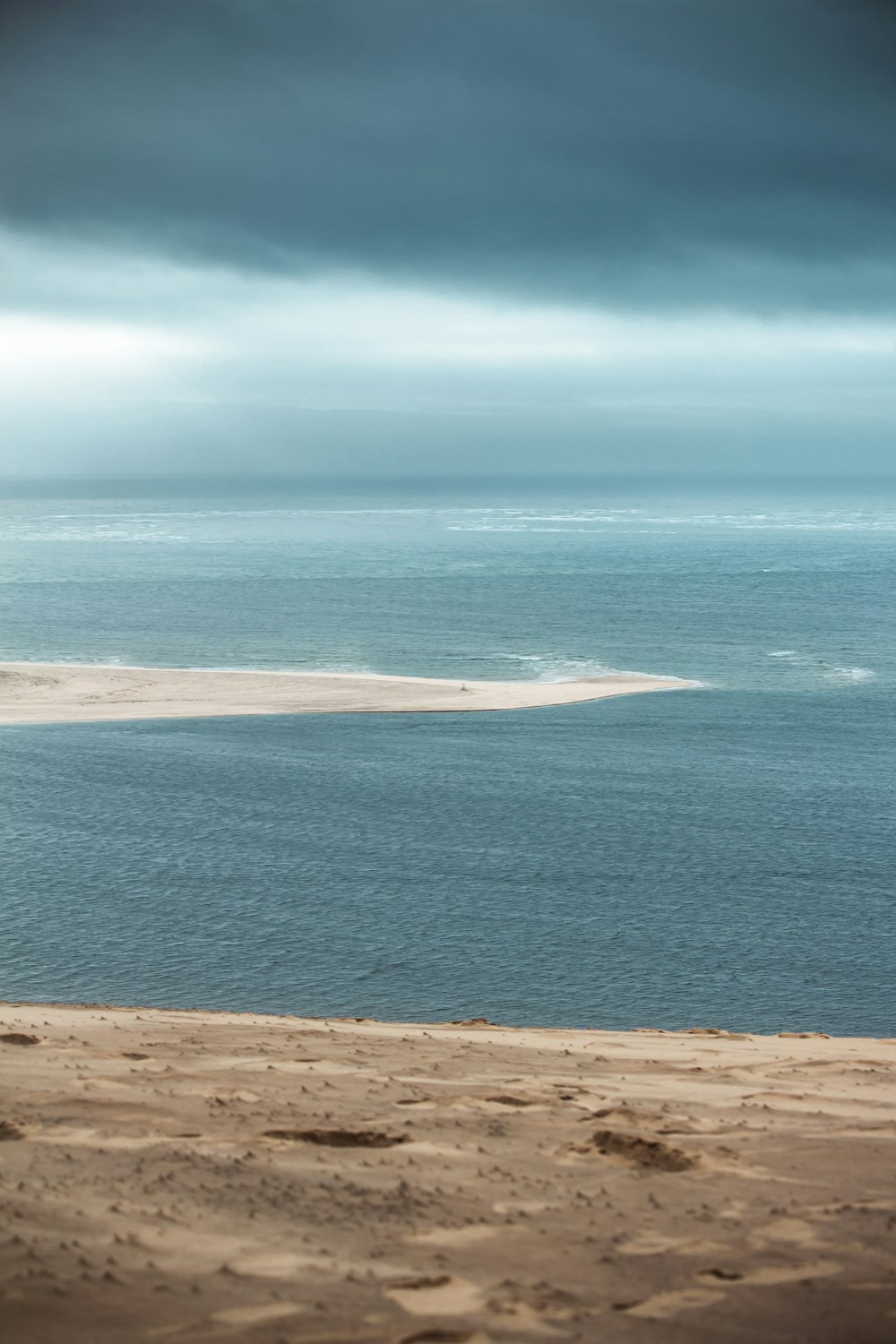 a beach with a body of water in the background