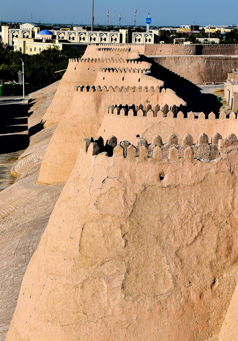 a large stone wall with a sign on it