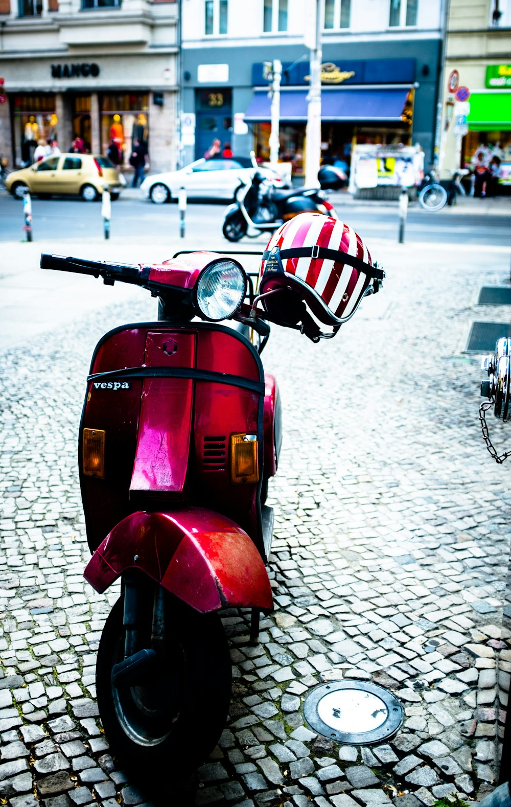 a red scooter with a santa hat on it